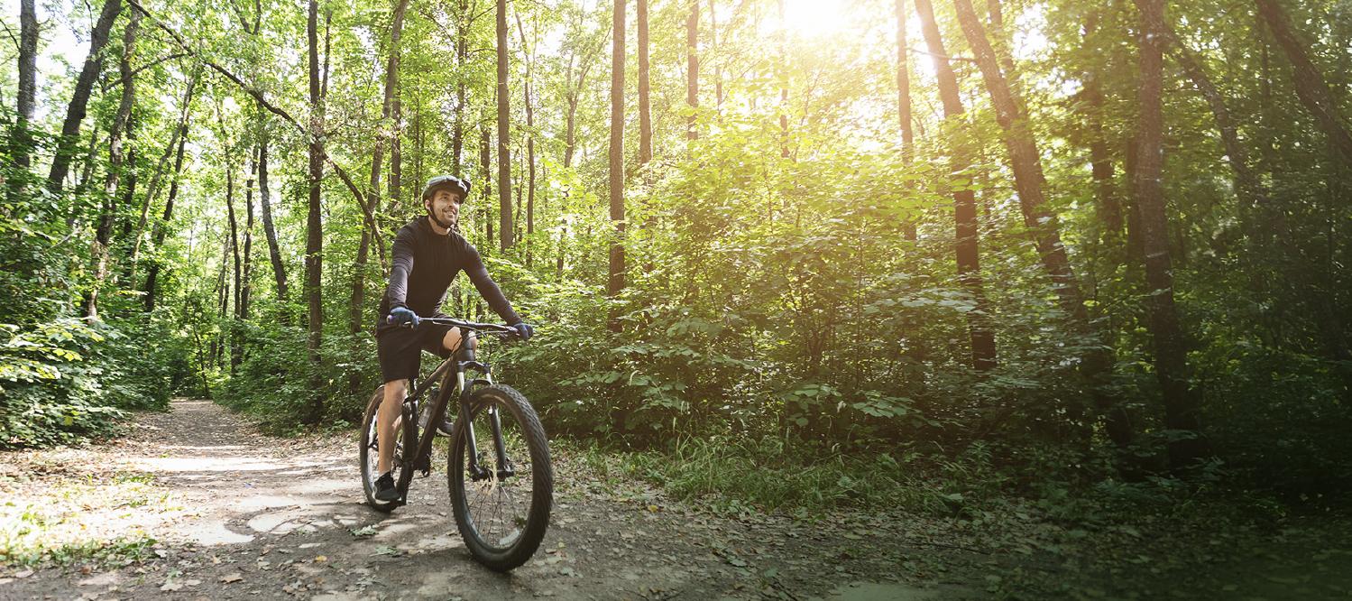Person riding bike outdoors